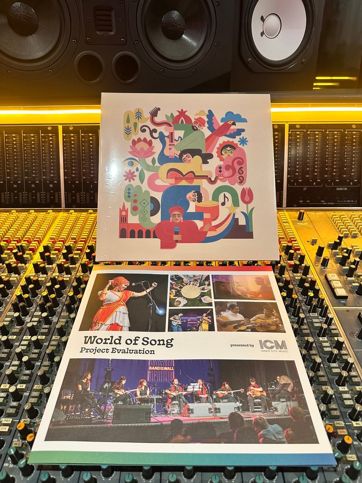 The World of Song vinyl and project evaluation sleeve resting on a mixing console